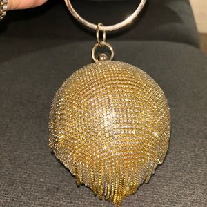 Gold rhinestone ball clutch